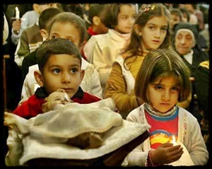 Iraqi children bring Christ Child to Creche on Christmas